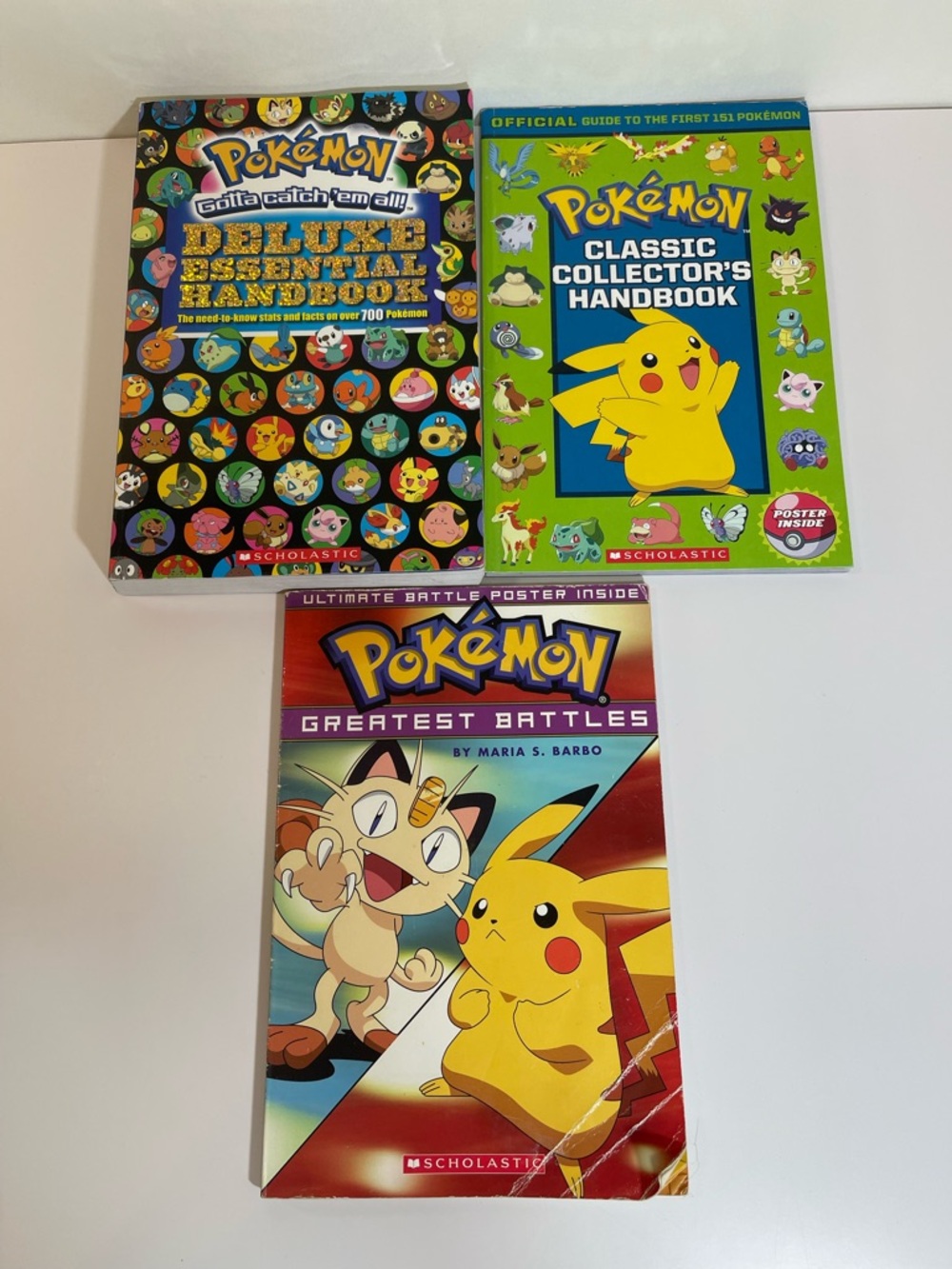 Pokémon Book Lot Deluxe Essential Handbook  + 2 More